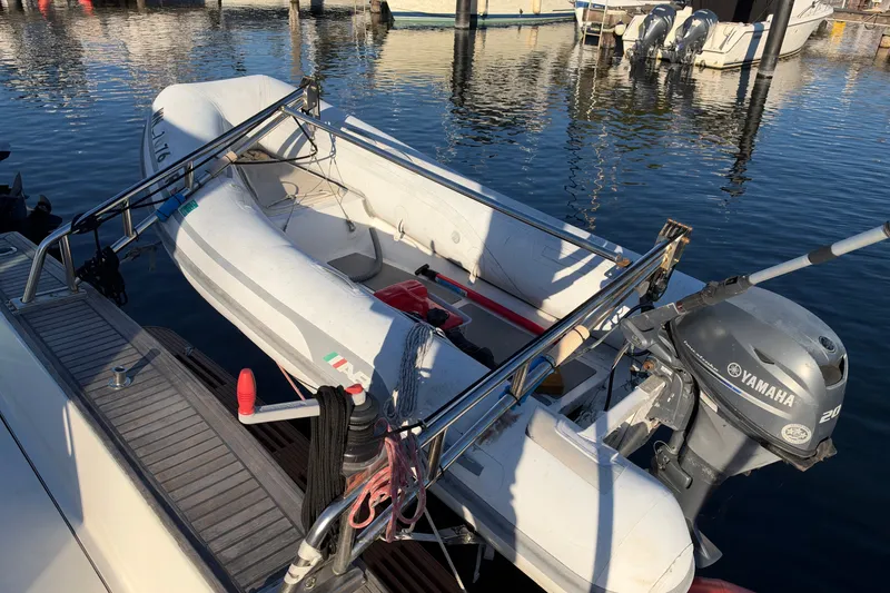 Slide: The Image of Inflatable boat with Yamaha motor docked at marina, featuring Covey Island Spencer Lincoln, 1997. - 38