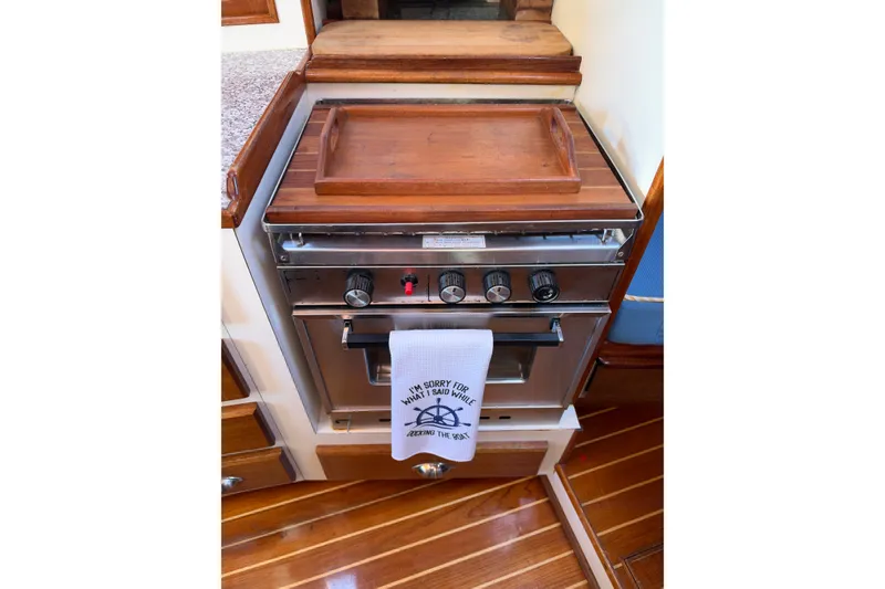 Slide: The Image of Covey Island Spencer Lincoln 1997 boat kitchen with stove and wooden countertop. - 15