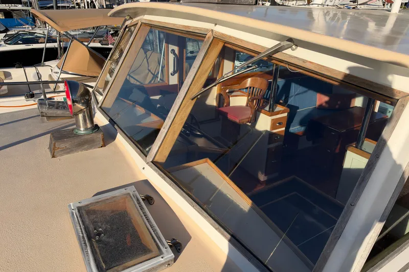 Slide: The Image of 1997 Covey Island Spencer Lincoln boat cabin with wooden interior and large windows. - 29