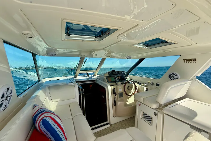 Slide: The Image of Interior of a 2006 Tiara Yachts 3600 Sovran, featuring helm and seating area. - 43