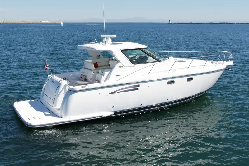 Slide: The Image of 2006 Tiara Yachts 3600 Sovran cruising on open water, showcasing sleek design and luxury. - 4
