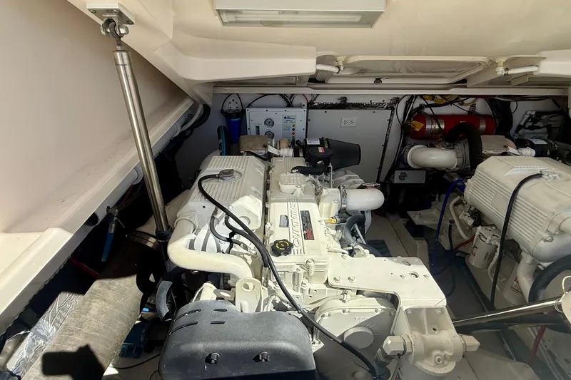 Slide: The Image of Engine room of a 2006 Tiara Yachts 3600 Sovran, showcasing mechanical components and systems. - 64