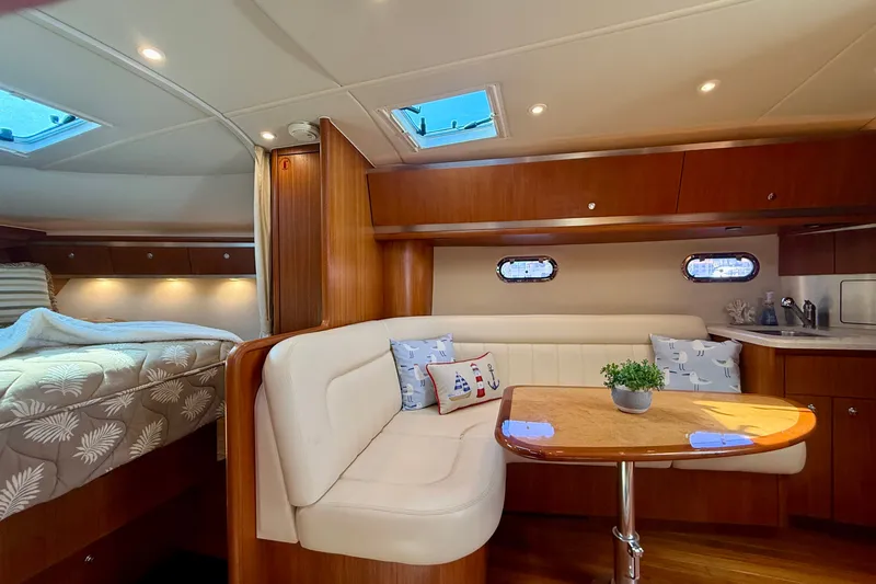 Slide: The Image of Luxurious 2006 Tiara Yachts 3600 Sovran interior with cozy seating and elegant wood finishes. - 16
