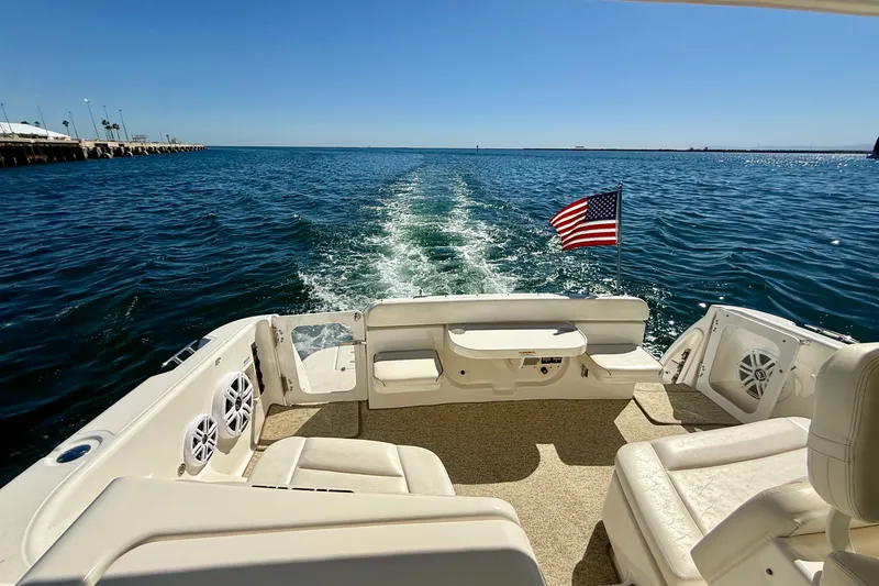 Slide: The Image of 2006 Tiara Yachts 3600 Sovran cruising on open water with American flag. - 58