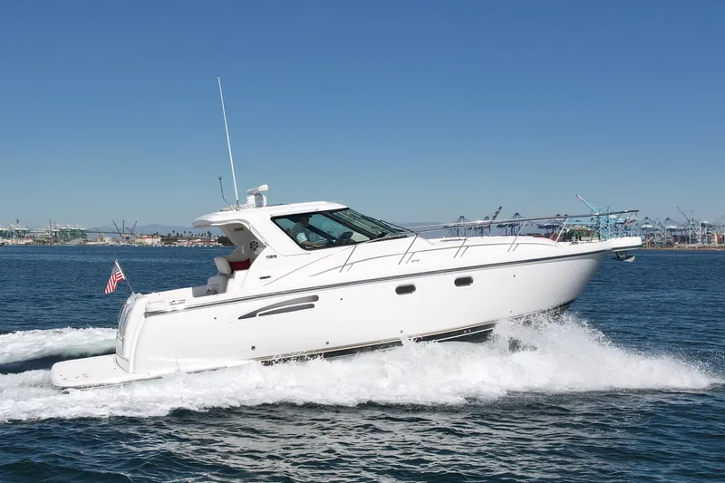 Slide: The Image of 2006 Tiara Yachts 3600 Sovran cruising on open water, showcasing sleek design and performance. - 5
