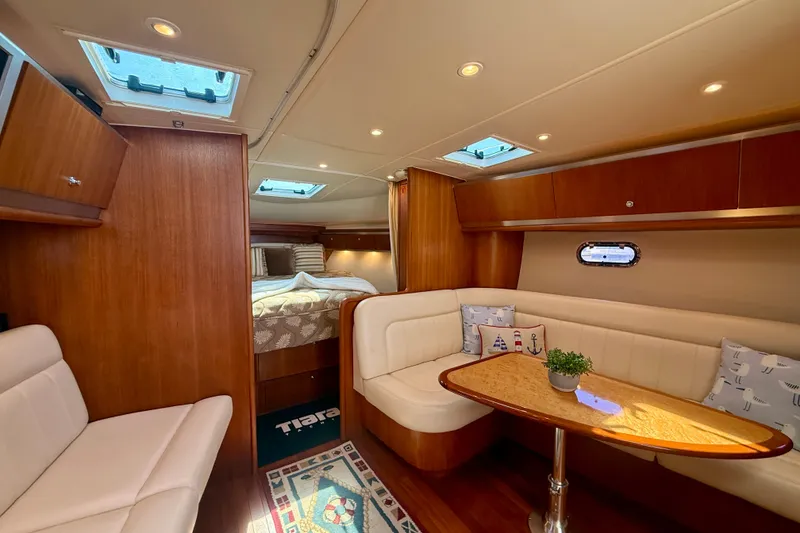 Slide: The Image of Luxurious interior of 2006 Tiara Yachts 3600 Sovran with elegant seating and cozy bedroom. - 17