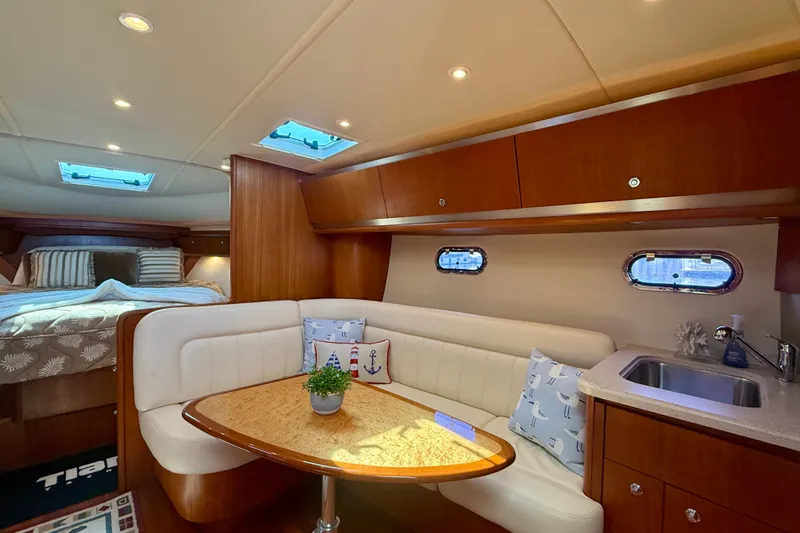 Slide: The Image of Luxurious interior of 2006 Tiara Yachts 3600 Sovran with cozy seating and elegant wood finishes. - 14