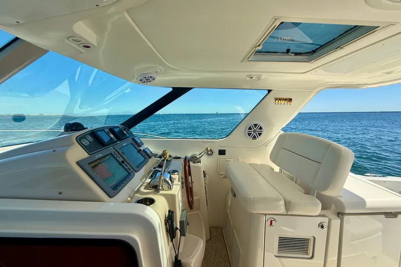 Slide: The Image of Helm of 2006 Tiara Yachts 3600 Sovran with ocean view and navigation equipment. - 41