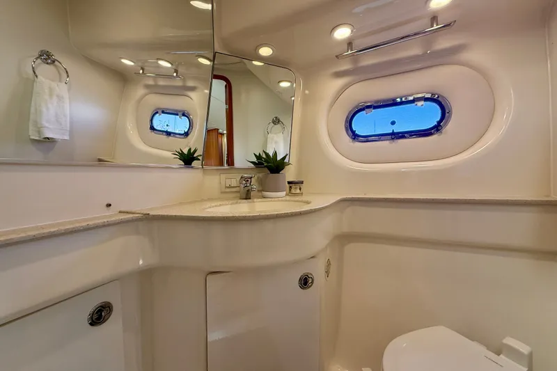 Slide: The Image of Luxurious bathroom interior of 2006 Tiara Yachts 3600 Sovran with porthole and modern fixtures. - 35