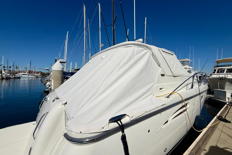 Slide: The Image of 2006 Tiara Yachts 3600 Sovran docked at marina under clear blue sky. - 74