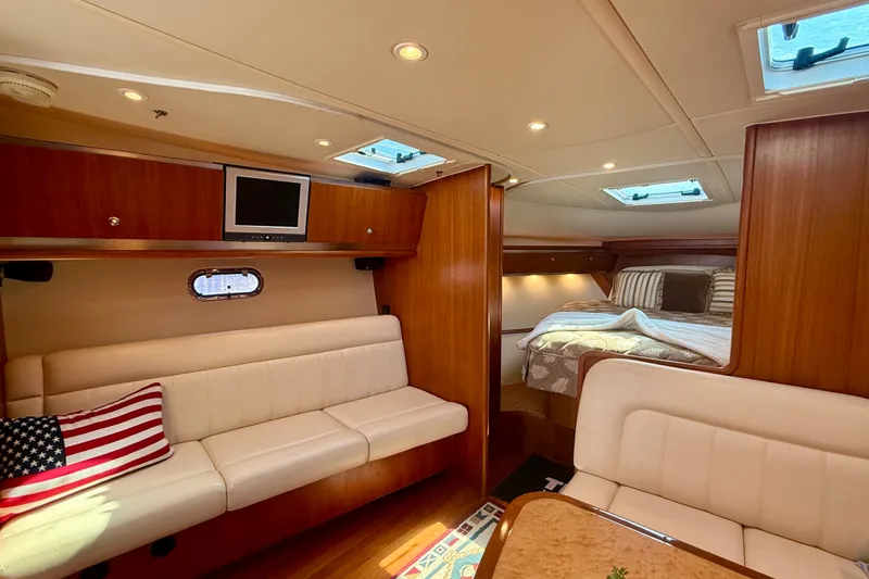 Slide: The Image of Luxurious interior of 2006 Tiara Yachts 3600 Sovran with cozy seating and elegant wood finishes. - 15