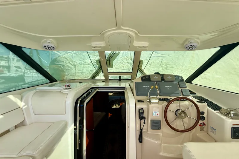 Slide: The Image of 2006 Tiara Yachts 3600 Sovran helm with steering wheel and navigation equipment. - 72