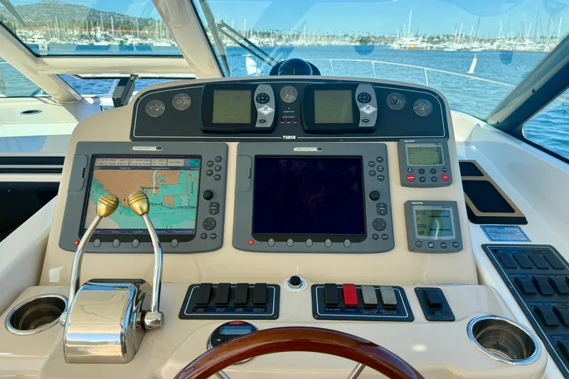 Slide: The Image of Helm of 2006 Tiara Yachts 3600 Sovran with navigation and control systems. - 57