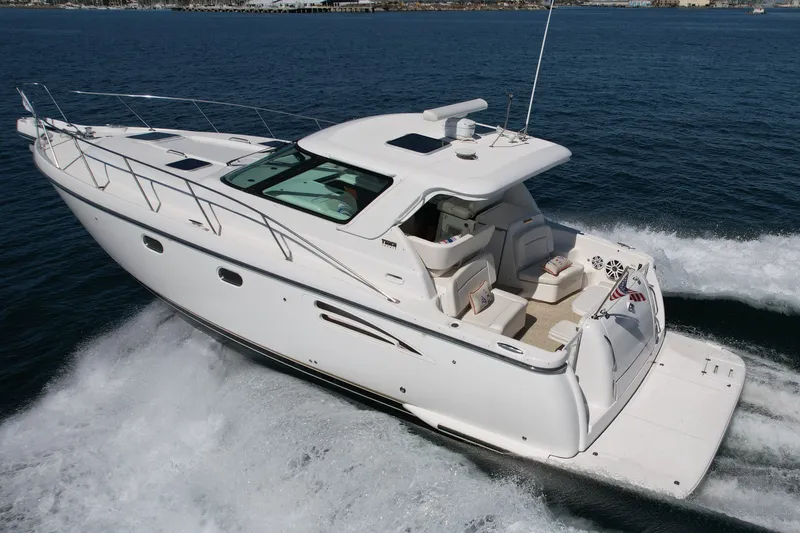 Slide: The Image of 2006 Tiara Yachts 3600 Sovran cruising on open water, showcasing sleek design and luxury features. - 3