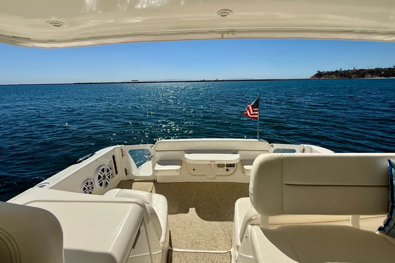 Slide: The Image of 2006 Tiara Yachts 3600 Sovran yacht deck with ocean view and American flag. - 42
