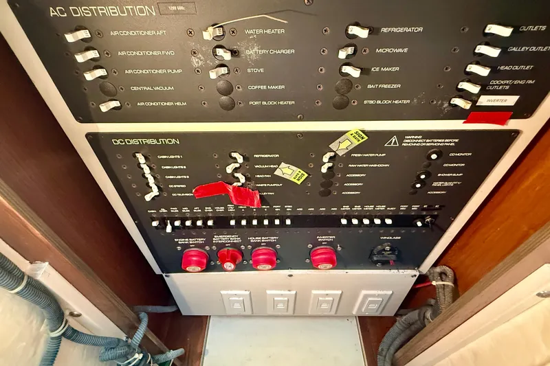 Slide: The Image of Electrical control panel on a 2006 Tiara Yachts 3600 Sovran, featuring AC and DC distribution. - 36