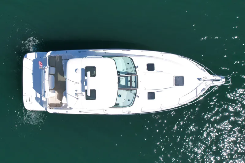 Slide: The Image of Overhead view of 2006 Tiara Yachts 3600 Sovran cruising on clear water. - 11