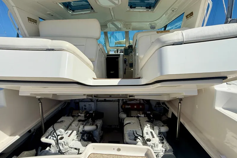 Slide: The Image of 2006 Tiara Yachts 3600 Sovran engine compartment with open hatch and seating area. - 62