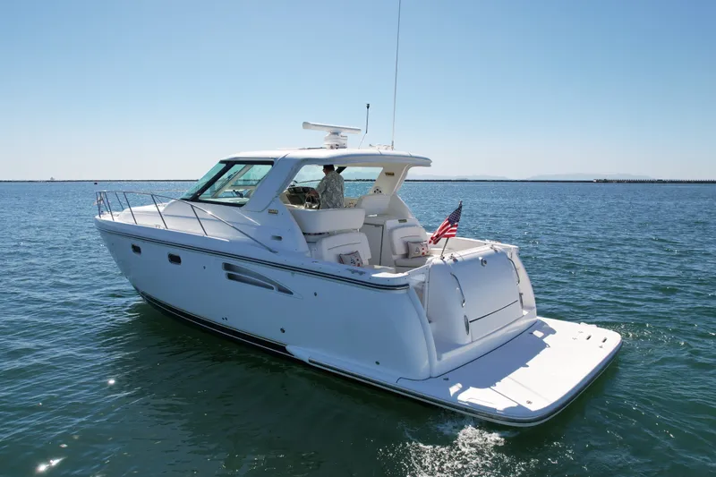 Slide: The Image of 2006 Tiara Yachts 3600 Sovran cruising on open water under clear skies. - 9
