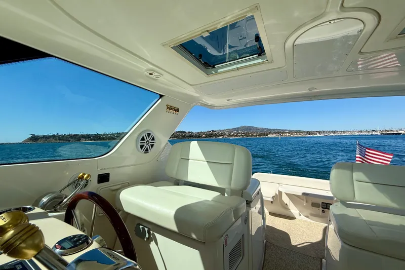 Slide: The Image of Interior view of a 2006 Tiara Yachts 3600 Sovran, overlooking a scenic ocean landscape. - 49