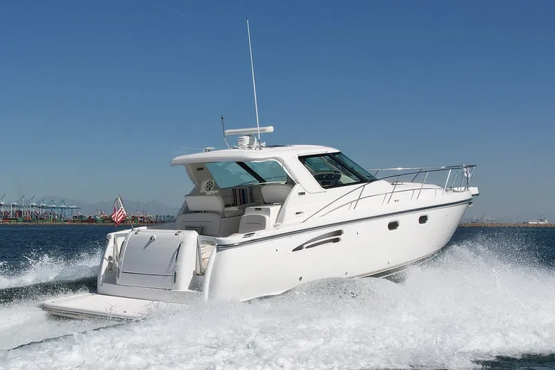 Slide: The Image of 2006 Tiara Yachts 3600 Sovran cruising on open water, showcasing sleek design and performance. - 1