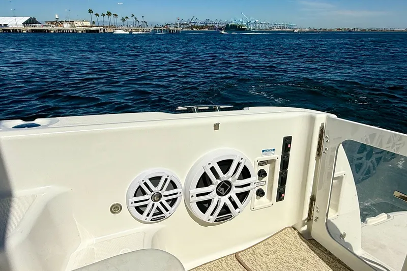 Slide: The Image of 2006 Tiara Yachts 3600 Sovran boat deck with speakers, overlooking a scenic waterfront. - 39