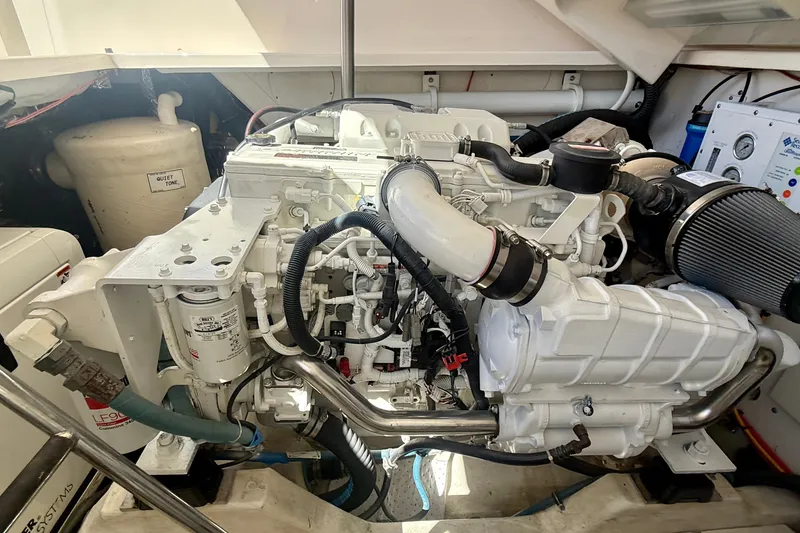 Slide: The Image of Engine compartment of a 2006 Tiara Yachts 3600 Sovran, showcasing detailed machinery. - 66