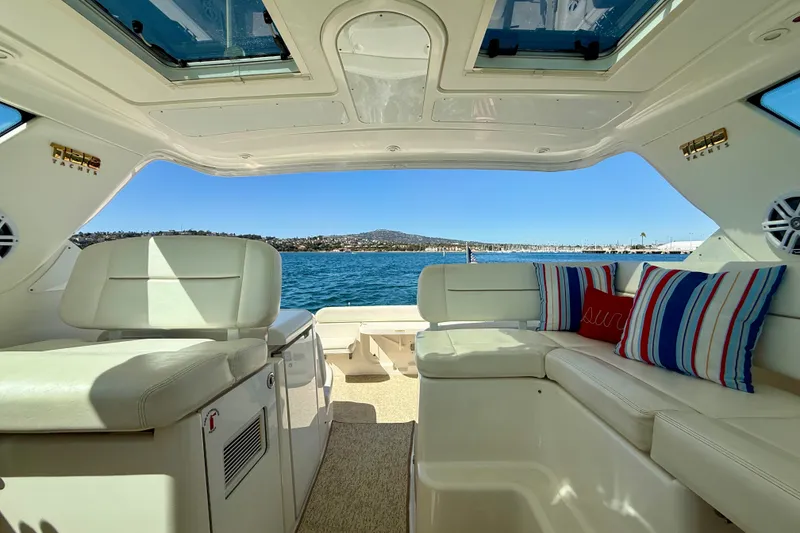 Slide: The Image of Interior view of 2006 Tiara Yachts 3600 Sovran, featuring plush seating and scenic ocean backdrop. - 50