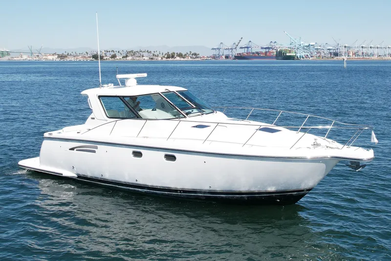 Slide: The Image of 2006 Tiara Yachts 3600 Sovran cruising on calm waters near a port. - 6