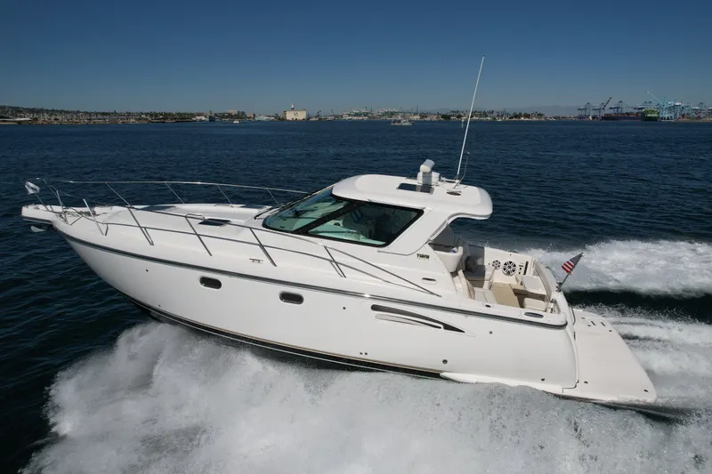 Slide: The Image of 2006 Tiara Yachts 3600 Sovran cruising on open water, showcasing sleek design and performance. - 2