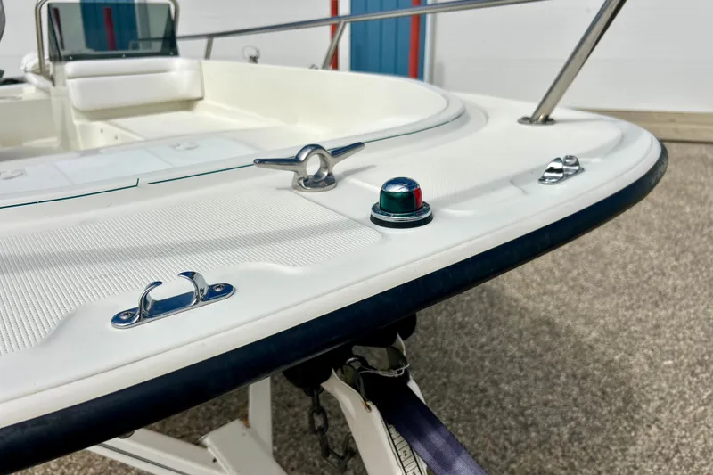 Slide: The Image of 1995 Wahoo 1650 boat deck with cleats and navigation light. - 25
