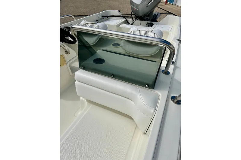 Slide: The Image of 1995 Wahoo 1650 boat interior with windshield and seating. - 24