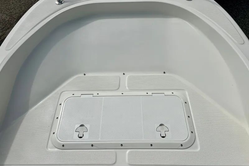Slide: The Image of Bow area of a 1995 Wahoo 1650 boat with storage compartment. - 32