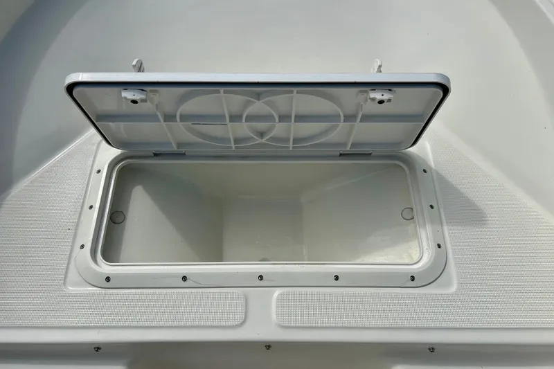 Slide: The Image of Open storage compartment on a 1995 Wahoo 1650 boat, showcasing interior space. - 33
