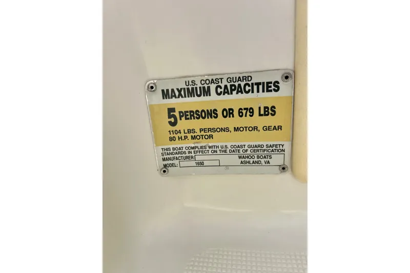 Slide: The Image of 1995 Wahoo 1650 capacity plate, U.S. Coast Guard certified for 5 persons or 679 lbs. - 17
