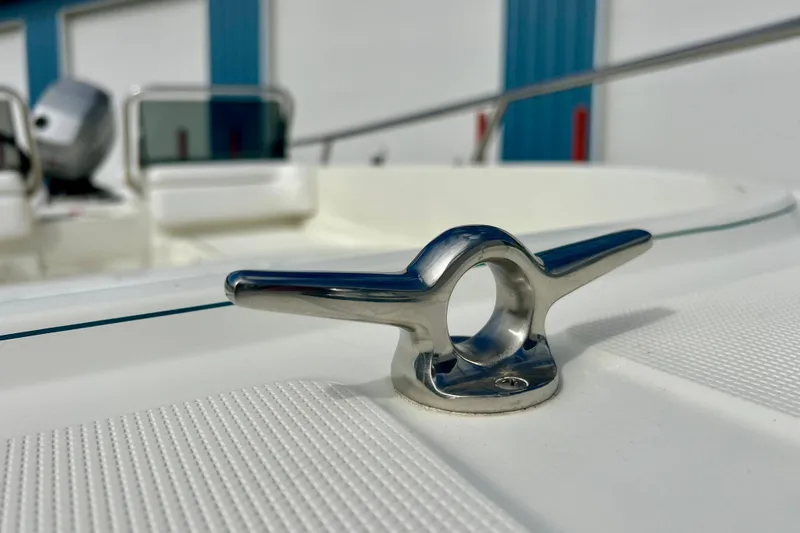 Slide: The Image of Close-up of a 1995 Wahoo 1650 boat cleat, showcasing sleek design and metallic finish. - 26
