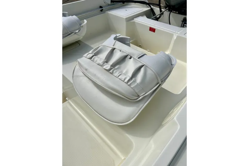 Slide: The Image of Boat interior with white cushioned seat, Wahoo 1650 model, 1995. - 23
