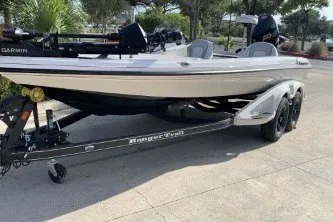 The Image of 2027 Ranger Z518VS boat on trailer, parked outdoors, side view. - 0