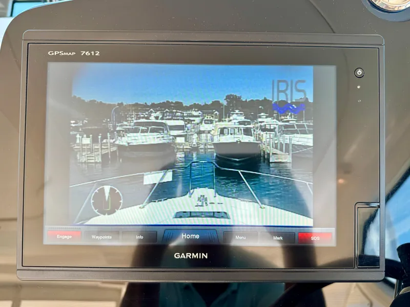 Slide: The Image of A Garmin navigation system displays a dock with several boats. - 35