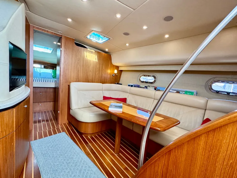 Slide: The Image of Interior of the 2006 Tiara Yachts 4300 Sovran with wood floors and leather seating. - 37