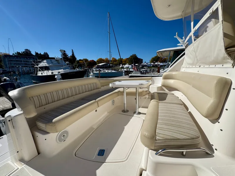 Slide: The Image of The image shows the cockpit of a 2006 Tiara Yachts 4300 Sovran with beige seating. - 20