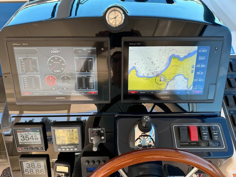 Slide: The Image of The dashboard of a 2006 Tiara Yachts 4300 Sovran with modern navigation systems. - 29