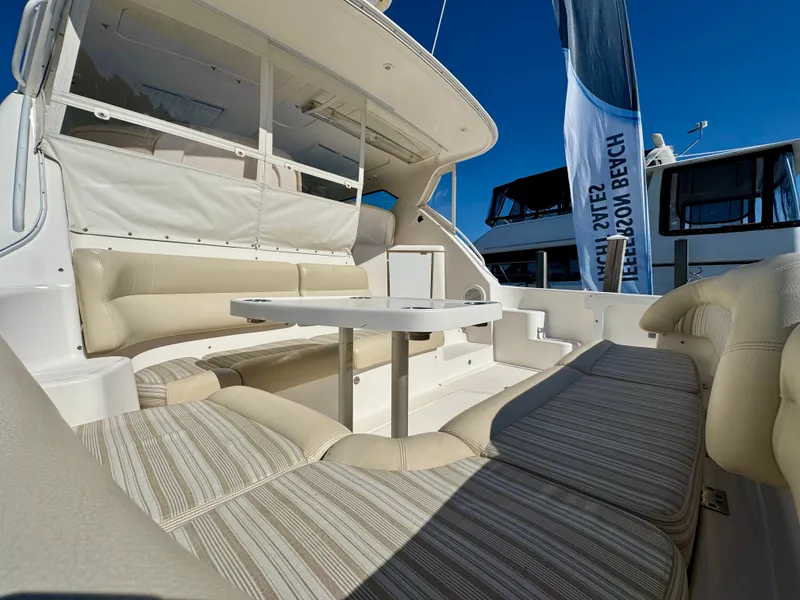 Slide: The Image of The 2006 Tiara Yachts 4300 Sovran features a spacious outdoor seating area with a table. - 2