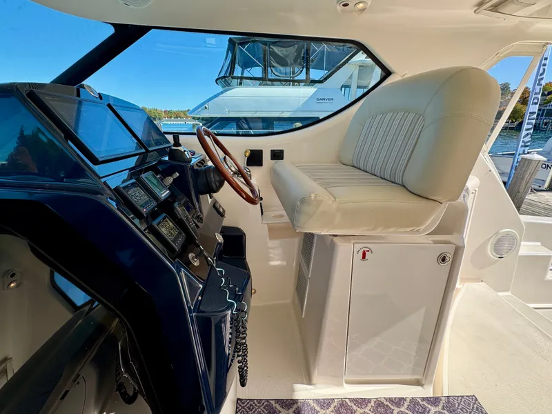 Slide: The Image of Interior view of the 2006 Tiara Yachts 4300 Sovran with modern helm and comfortable seating. - 27