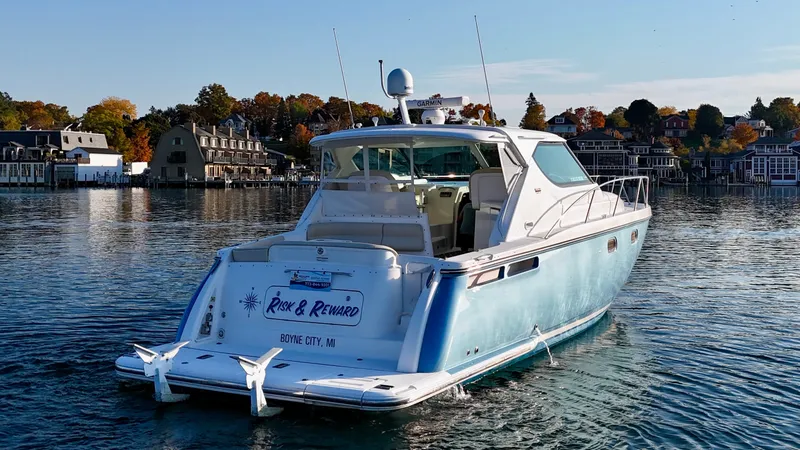 Slide: The Image of A 2006 Tiara Yachts 4300 Sovran cruising on calm waters. - 8