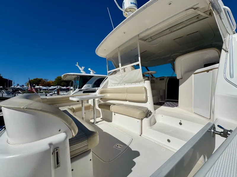 Slide: The Image of The image shows the spacious cockpit of a 2006 Tiara Yachts 4300 Sovran with beige seating. - 19