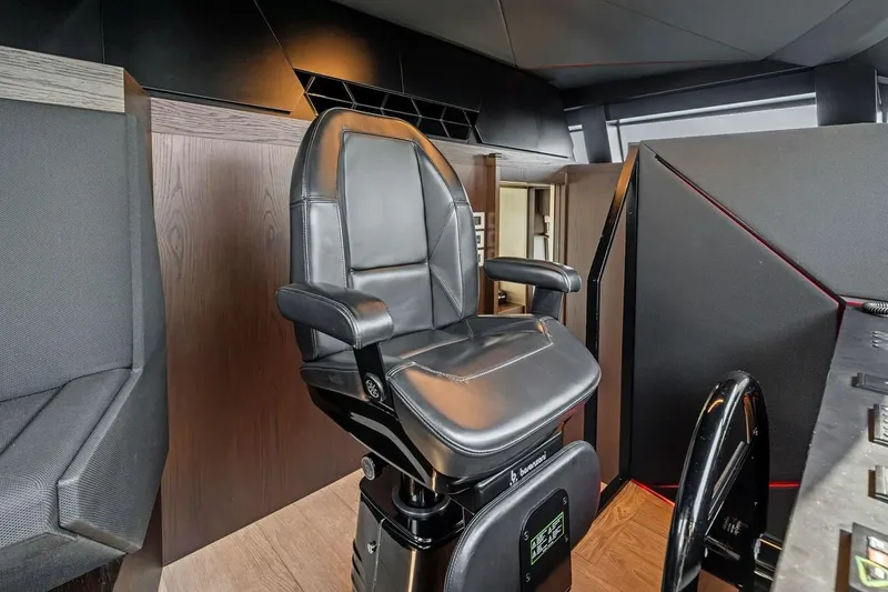 Slide: The Image of Captain's chair in the helm of a 2022 Ferretti 850 yacht, featuring sleek design. - 40