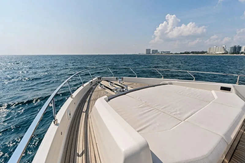 Slide: The Image of Luxurious 2022 Ferretti 850 yacht deck with ocean view and city skyline. - 25