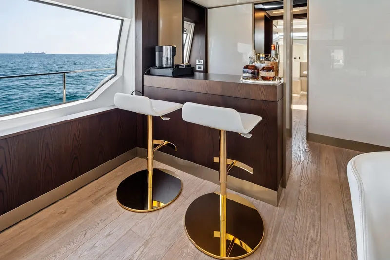 Slide: The Image of Luxurious interior of 2022 Ferretti 850 yacht with elegant bar and ocean view. - 79