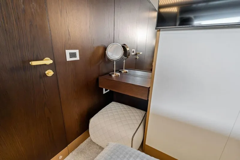 Slide: The Image of Luxurious interior of 2022 Ferretti 850 yacht with elegant vanity and seating. - 49